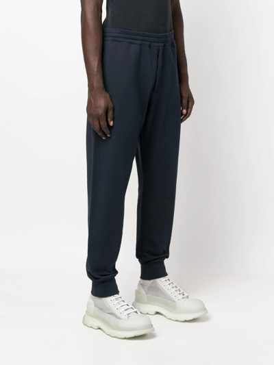 Alexander Mcqueen Motif-print Cotton Joggers In Blue