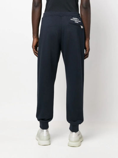 Shop Alexander Mcqueen Motif-print Cotton Joggers In Blue