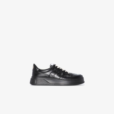 Shop Gucci Black Gg Embossed Low-top Leather Sneakers