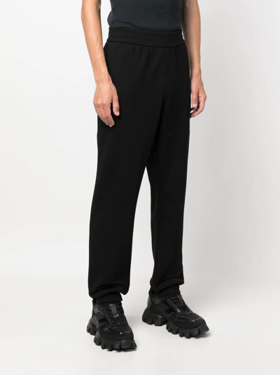 Shop Versace Logo-print Track Pants In Schwarz