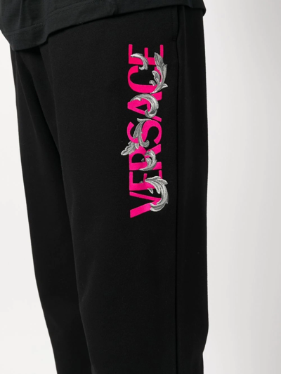 Shop Versace Logo-print Track Pants In Schwarz