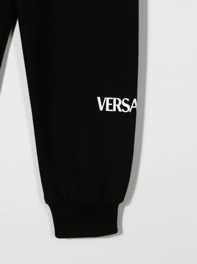 Shop Versace Logo-print Cotton Track Pants In Black