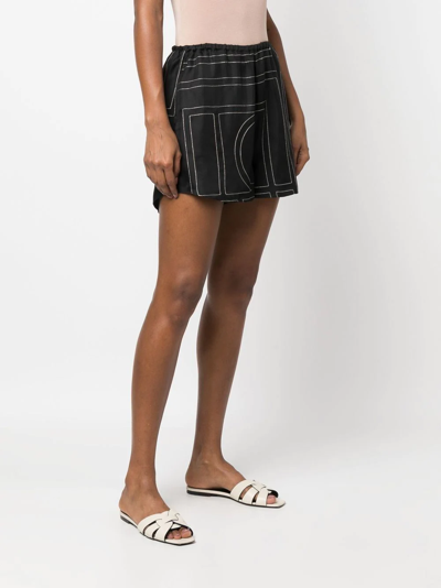 Shop Totême Geometric-print Silk Shorts In Black