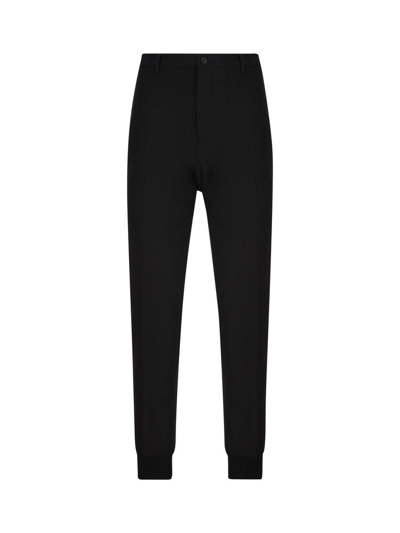 Shop Prada Buttoned Tapered Leg Pants In Black