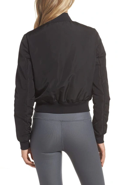 Shop Alo Yoga Off Duty Bomber Jacket In Black