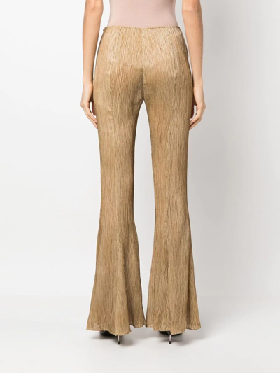 Shop Acne Studios Flared Plissé Silk Trousers In Brown