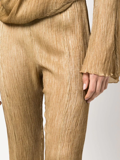 Shop Acne Studios Flared Plissé Silk Trousers In Brown