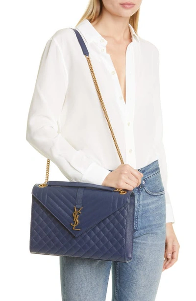 Shop Saint Laurent Monogram Leather Envelope Bag In Blue Charron
