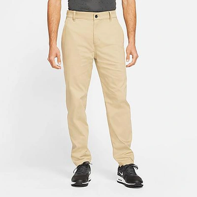 Shop Nike Men's Dri-fit Uv Standard Fit Golf Chino Pants In Parachute Beige
