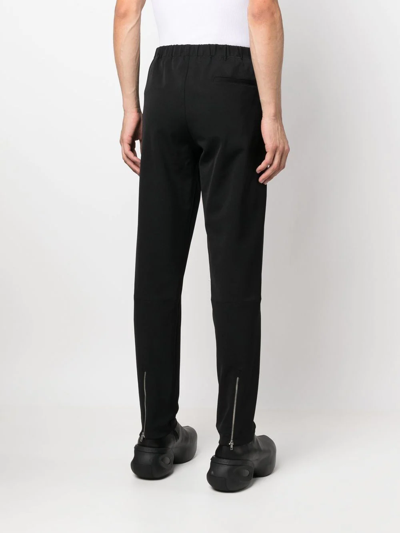 Shop Alyx High-waisted Tapered Trousers In Black