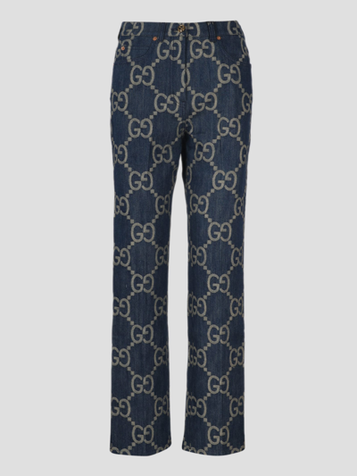 Shop Gucci Jumbo Gg Denim Trousers In Blue
