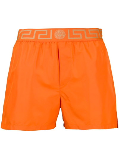 Shop Versace Greca-waistband Swim Shorts In Orange