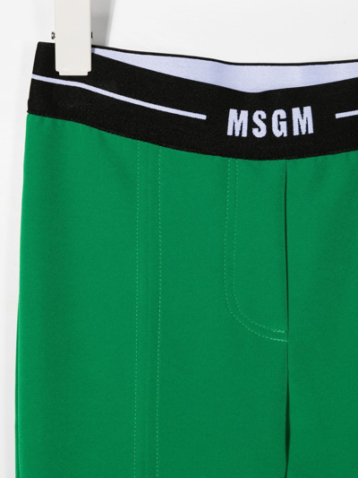 Msgm Logo-waistband Flared Trousers In Green