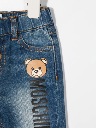 Shop Moschino Logo-print Straight-leg Jeans In Blue