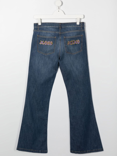 Shop Moschino Mid-rise Flared Jeans In Blue