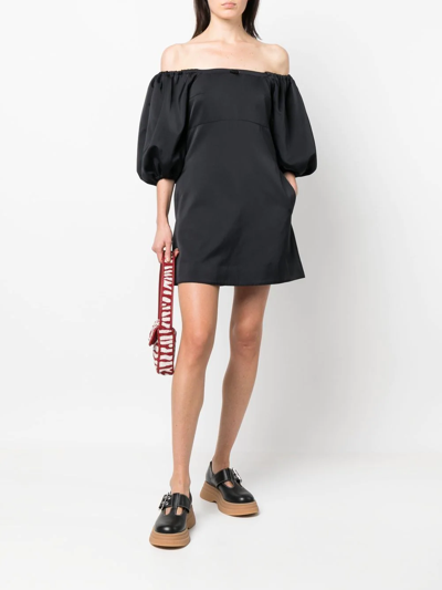 Shop Patou Off-shoulder Puff Sleeve Mini Dress In Black