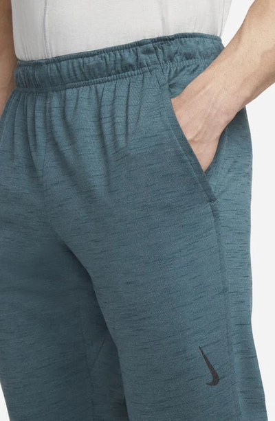 Shop Nike Pocket Yoga Pants In Ash Green/ Armory Navy/ Black