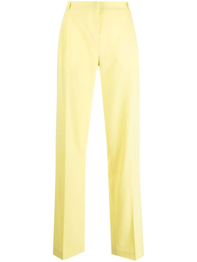 Shop Coperni Pressed Twill Trousers In Yellow