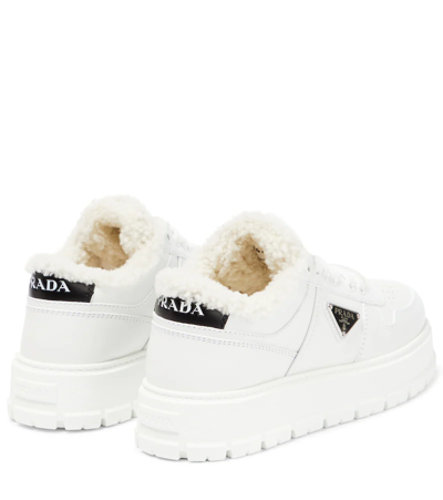 Prada Leather Shearling Lug-sole Sneakers In Bianco