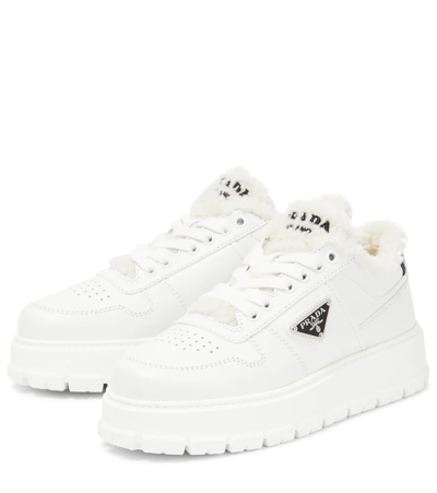 Prada Leather Shearling Lug-sole Sneakers In Bianco