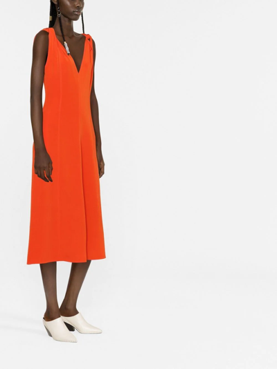 Shop Victoria Beckham Twist-shoulder Fit-and-flare Dress In Orange