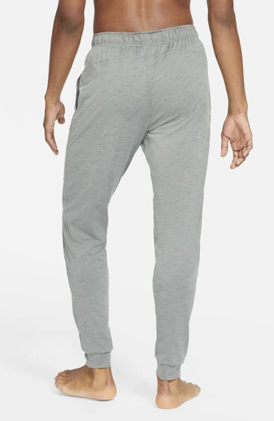 Shop Nike Pocket Yoga Pants In Smoke Grey/ Iron Grey/ Black