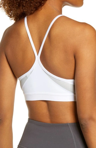 Shop Nike Indy Mesh Inset Sports Bra In Grey Fog/ Particle Grey
