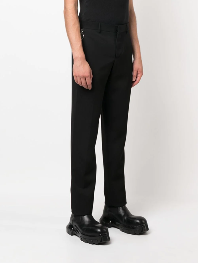 Shop Moschino Mid-rise Slim-cut Trousers In Black
