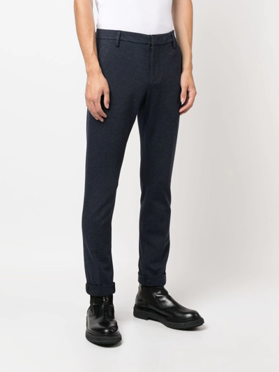 MID-RISE TAPERED TROUSERS
