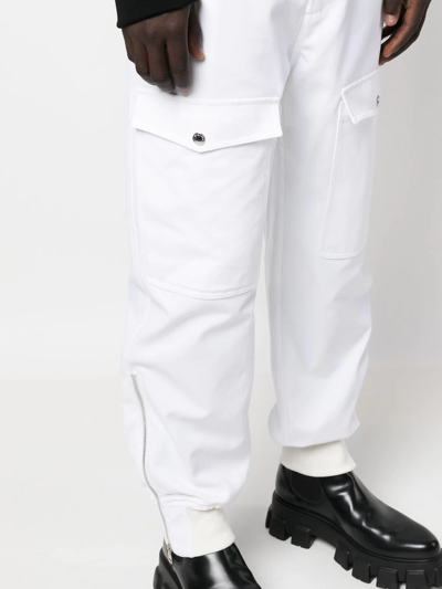 Shop Alexander Mcqueen Tapered Cargo Trousers In Weiss