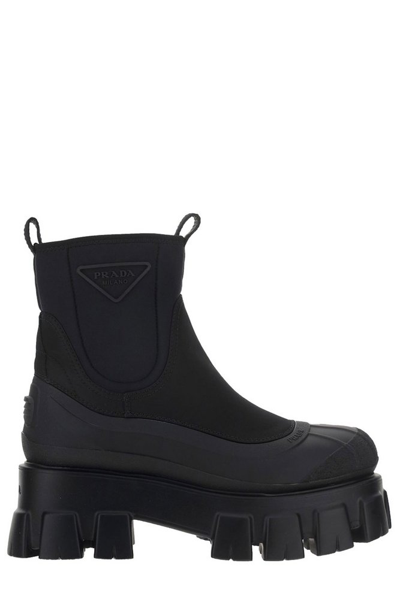 Shop Prada Monolith Logo Detailed Ankle Boots In Black