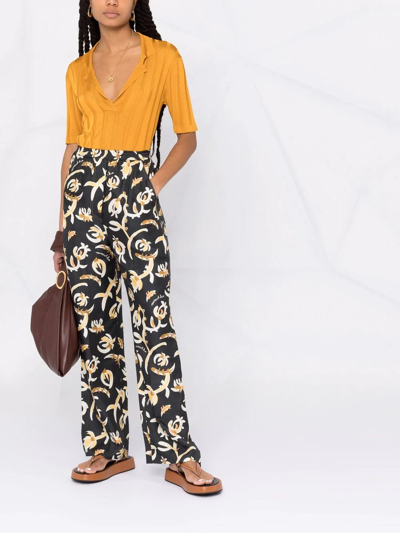 Nanushka Graphic Floral-print Elasticated-waist Trousers In Black