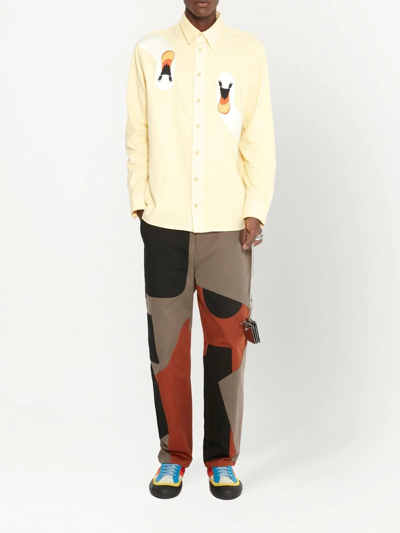 Shop Jw Anderson Patchwork Cotton Trousers In Brown