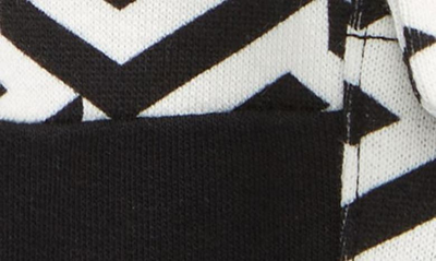 Shop Versace La Greca Cotton Knit Cargo Joggers In White Black