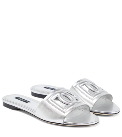 Shop Dolce & Gabbana Logo Cutout Metallic Leather Slides In Argento