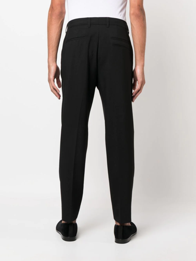 Shop Dolce & Gabbana Logo-buckle Tapered Trousers In Schwarz