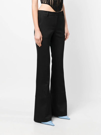 Shop Blumarine Low-rise Flared Trousers In Schwarz