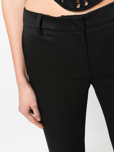 Shop Blumarine Low-rise Flared Trousers In Schwarz