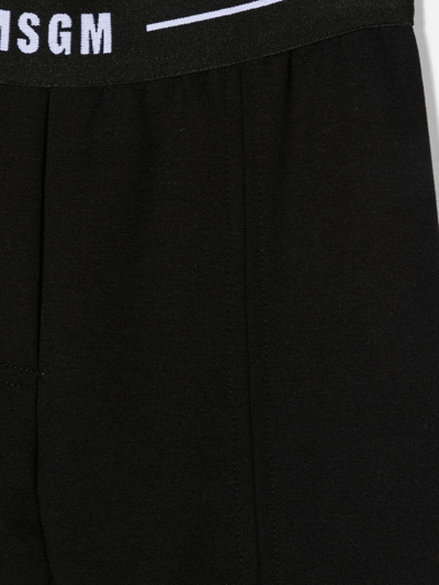 Msgm Logo-waist Flared Jersey Trousers In Blue