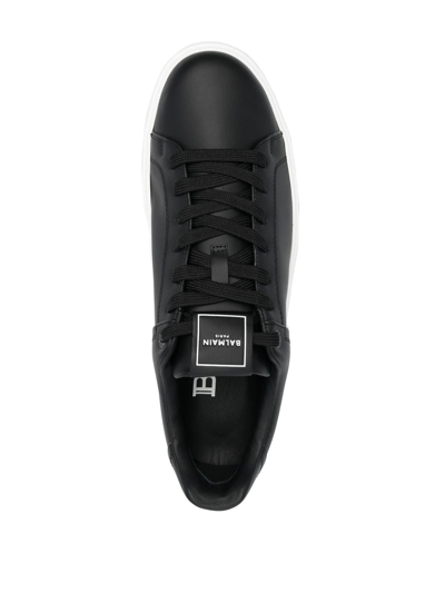 Shop Balmain Leather Low-top Sneakers In Black
