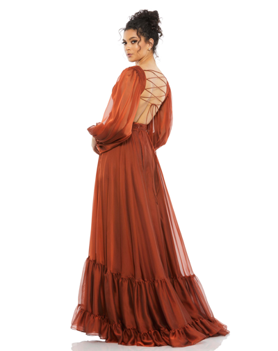 Shop Mac Duggal Pleated Cut Out Long Sleeve Lace Up Tiered Gown In Copper