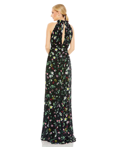 Shop Ieena For Mac Duggal Floral Print Asymmetrical Ruffle Slit Halter Gown In Black Multi