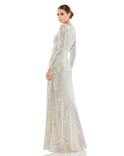 Shop Ieena For Mac Duggal Sequined Faux Wrap Long Sleeve Gown In Silver
