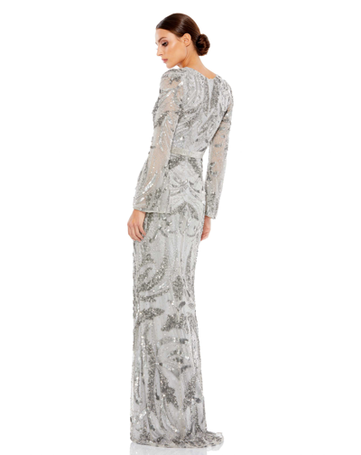 Shop Mac Duggal Sequined Faux Wrap Split Long Sleeve Gown In Platinum