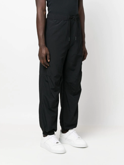 Shop Marcelo Burlon County Of Milan Drawstring-fastening Waistband Trousers In 1001 Black White