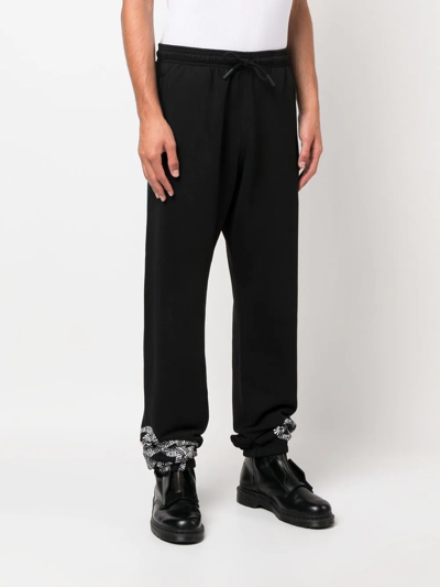 Shop Marcelo Burlon County Of Milan Logo-print Tapered Sweatpants In Black