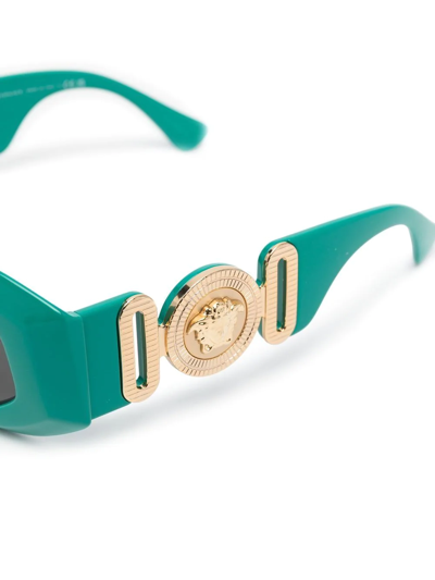 Shop Versace Medusa Head-detail Oval-frame Sunglasses In Green