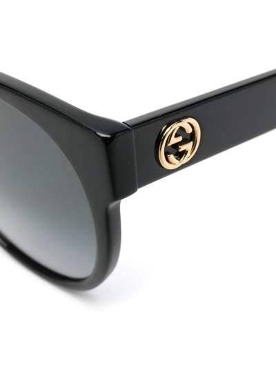 Shop Gucci Gg-logo Round-frame Sunglasses In Black