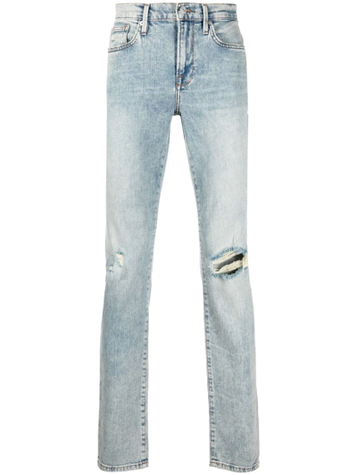 Shop Frame Distressed Slim-cut Jeans In Blue