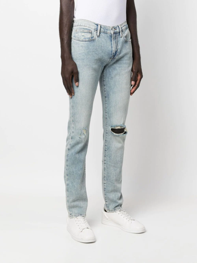 Shop Frame Distressed Slim-cut Jeans In Blue
